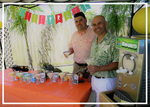 Jay and Eric in their backyard enjoying frozen cocktail mixes